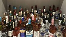 60-liquor-bottles-32-lakh-cash-probe-agency-raids-drug-controller-office