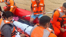 aryadan-shoukat-and-a-team-of-officials-carrying-billys-body-trapped-in-forrest