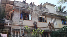 man--climbed-to-the--building-and-threatened-to-commit-suicide-was-caught-by-a-rescue-net-in-thrissur