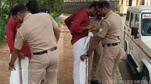 police-helps-student-wear-mundu