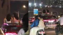 viral-video-woman-sitting-on-moving-suv-sunroof-in-mumbai-sparks-concerns