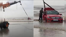 benz-car-sinks-into-the-sand-of-the-sea
