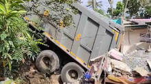 truck-overturns-on-top-of-house-building-completely-collapses