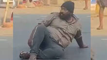man-turns-out-to-be-a-nuisense-as-he-sits-on-the-middle-of-a-busy-road