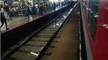 heavy-rain-railway-station-tracks-flooded
