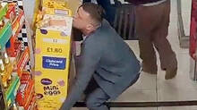 man-stealing-chocolate-held