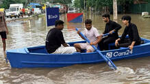 cars24-boat-flooded-gurugram-road