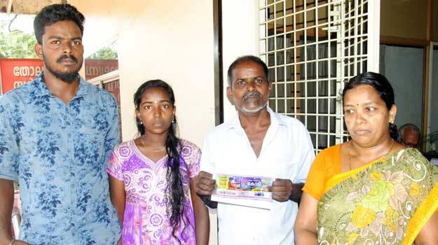 Image result for KANNUR: Perunnal Rajan, who won the first prize of Rs 12 crore in Kerala New Year-Christmas Bumper